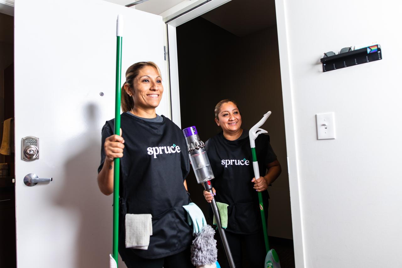 Spruce Cleaning Professionals entering short-term vacation rental unit.